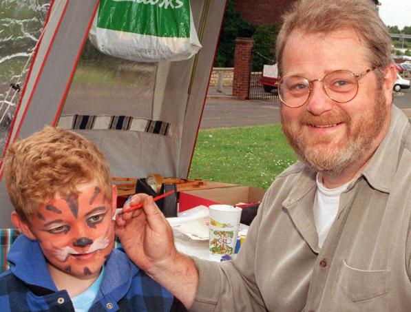 Joseph Baxendale aged seven getting his face painted by his father Neil in 1998.