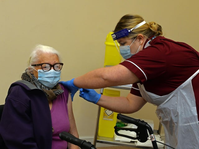 Ann Duggan, is the first to recieve the Covid-19 Vaccination in Doncaster. Picture: NDFP-15-12-20-CovidVaccine 2-NMSY