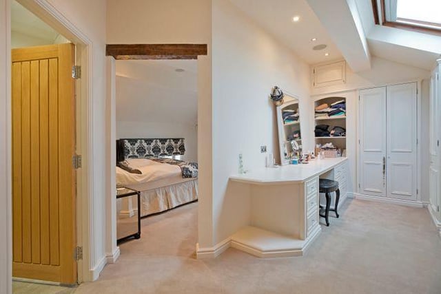 A spacious landing leads to a splendid master bedroom suite