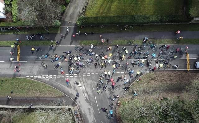 Around 60 protesting cyclist lie in the road at mouth of Common Lane
