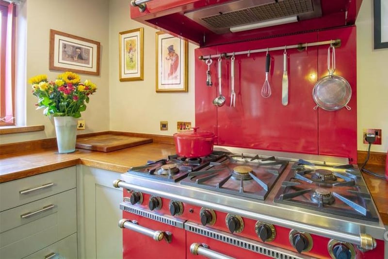 The kitchen is fitted with a range of integrated appliances, stylish units, cabinets and work surfaces. But the highlights is this Aga, which will turn you into a  masterchef!