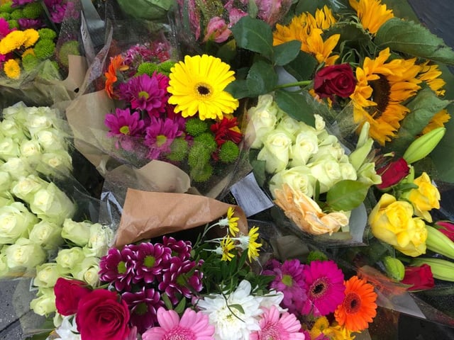 Dozens of flowers were laid on Wednesday morning