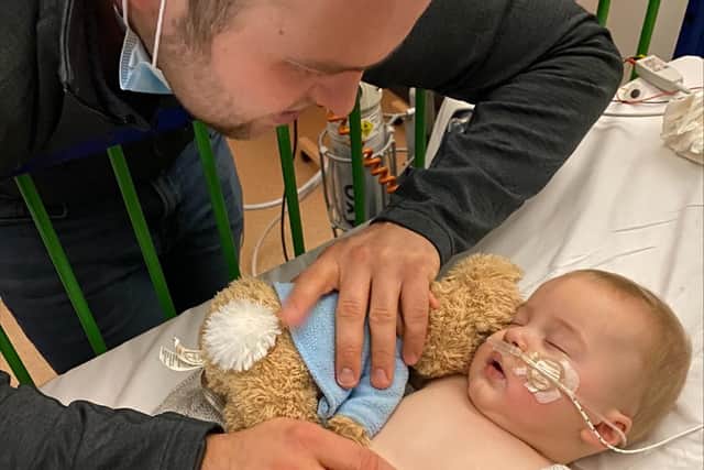 Worried mum Faith Pearson has told how a ‘devastating’, resurgent illness landed her baby in Sheffield Children’s Hospital – just days before Christmas. Dad Jack Allen is pictured looking after George during his time in Sheffield Children's Hospital. Picture: Faith Pearson.