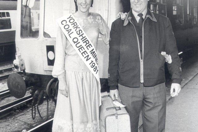 Railman Fred Barker helps Yorkshire NUM Coal Queen, Joanne Parkin of Blackstock Crescent, Norton onto the train at Sheffield Midland Station that will take her to the National Coal Queen Finals in November 1984