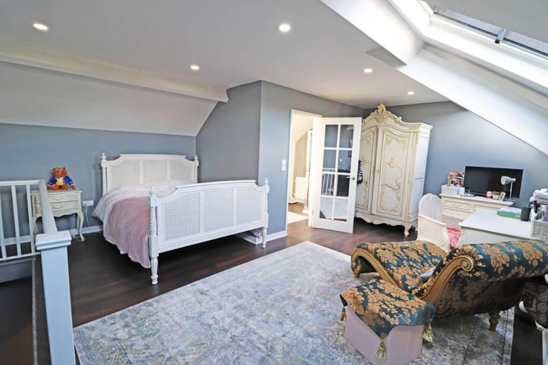 The master bedroom is within the converted loft space and is complete with an en suite.