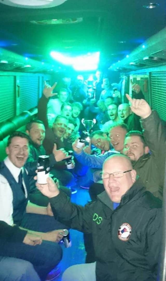 A group of men on one of Ky's party buses.