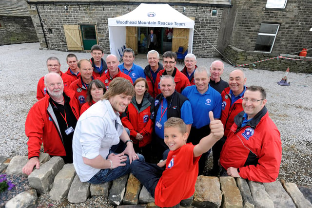Two Stars from TV's Emmerdale Farm Matt Wolfenden who plays 'David Metcalfe'(left) and Joe Warren Plant who plays'Jacob Gallagher', opened the new £140,000 Woodhead Mountain Rescue Centre, at Hepshaw Farm, Crow Edge, Penistone,  back in 2011. Pictured are the two stars with Rescue Volunteers and the new centre in the background