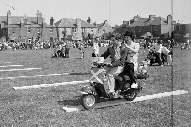 Harry Davidson and Elizabeth Lang having a spot of bother in the novelty race at the Dunbar Scooter Rally in May 1961.