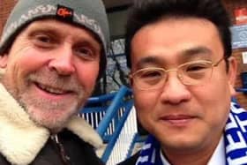Sheffield Wednesday fan Sim Dodd with the club's owner Dejphon Chansiri. Tributes have been paid to Sim, who collapsed and died, aged 61, shortly after playing a gig in Thailand, where he lived