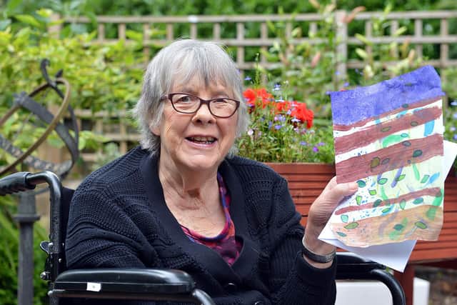 Twelve Trees resident Freda Armstrong holding a drawing which she received from a Year 4 pupil at Carterknowle Primary