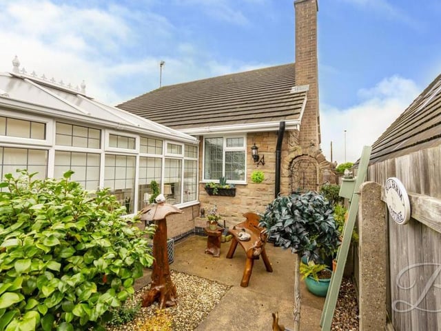 The garden offers plenty of pleasant places to sit and relax, including this secluded patio area.