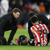 lliman Ndiaye of Sheffield United receives medical attention before making way against Stoke: Lexy Ilsley / Sportimage