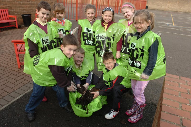 Pupils at St. Anne's RC Primary School, Pennywell, Sunderland were clearing litter from the school grounds as part of a general tidy up of the school, which included tree and flower planting in 2010.