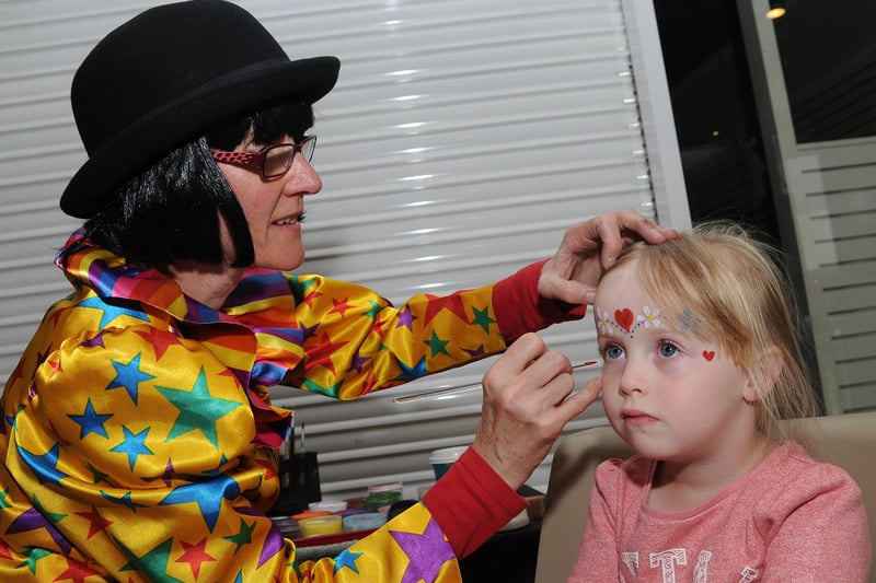 Tyla Webster, aged three, of Halfway has her face painted by Tricky Trudy of Greentop Circus at Crystal Peaks Shopping Centre as part of their summer holiday fun