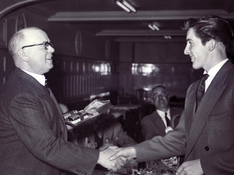 A gallant second in the Star Walk, 24 year old Dennis Skinner of Chesterfield, receives his prize from the Lord Mayor of Sheffield, Ald. J. Curtis at a lunch at Davy's Cafe, Sheffield, on May 22 1956