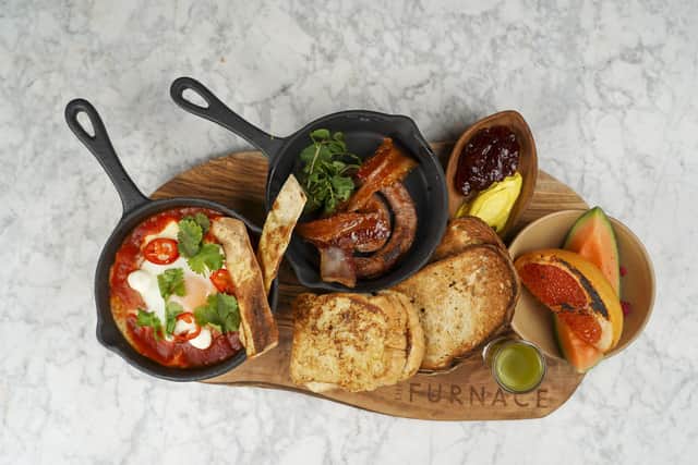 Brunch board containing shakshuka; sausage and bacon; seeded bread; melon and grapefruit; Nutella French toast and green juice boost. Picture: Scott Merrylees