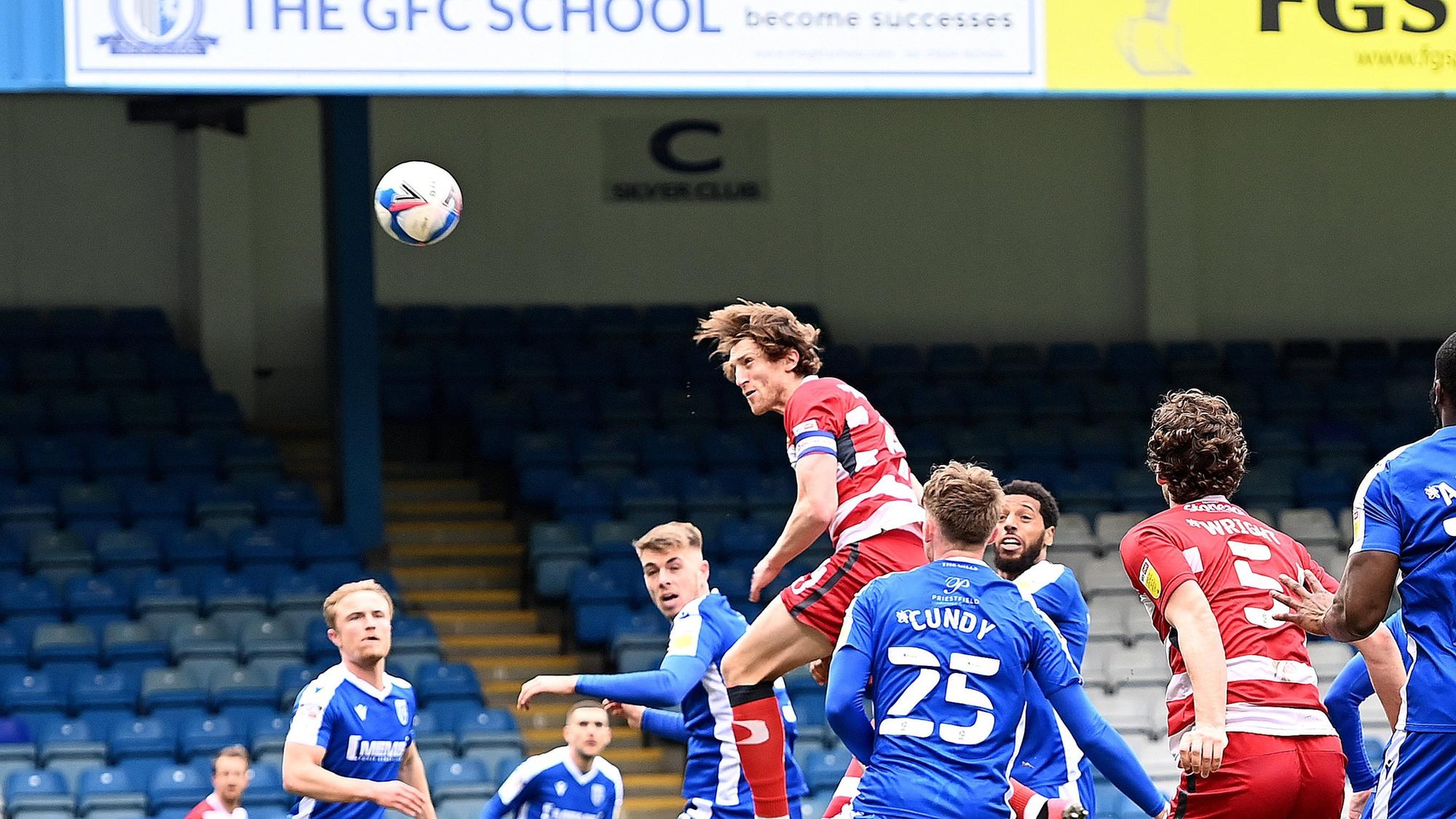 Tom Anderson heads Rovers back into the game against Gillingham. Picture: Howard Roe/AHPIX