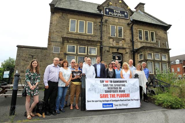 Campaigners outside the Plough Inn on Sandygate Road in Crosspool, Sheffield. The building and land have gone on sale for offers of around £2.2 million - one year after planning permission was secured to demolish the former pub and replace it with eight new town houses