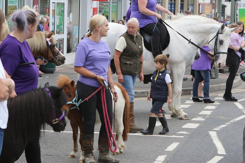 Crowds gather on Sheffield Road. Many wore purple clothing or horse riding attire, as requested by Gracie's family.
