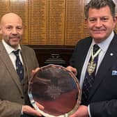 Mark Ritson, left, hands the 1871 silver salver to Master Cutler James Tear at the Cutlers’ Hall.