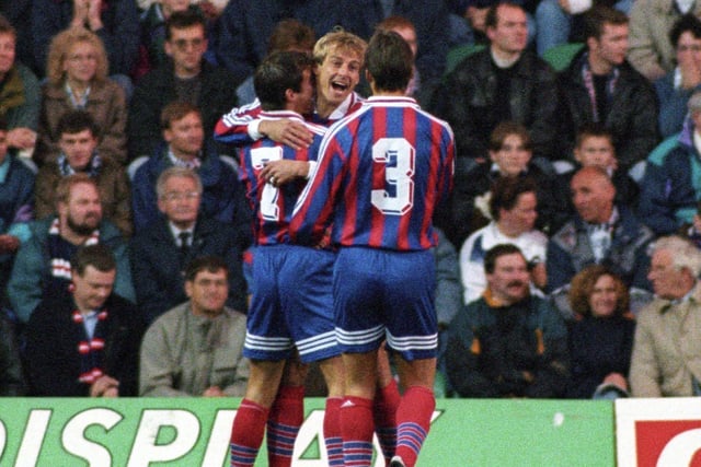 Jurgen Klinsman is congratulated by team-mates after scoring for Bayern Munich in October 1995's UEFA Cup second round game at Easter Road in Edinburgh against Raith Rovers. Photo: SNS Group