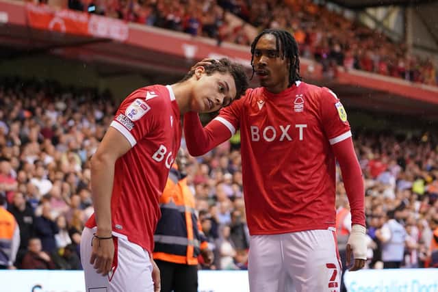 Nottingham Forest's Djed Spence (right) celebrates the opening goal from team mate Brennan Johnson: Zac Goodwin/PA Wire.