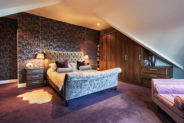 There are five bedrooms in the property in total, with this master room being reminiscent of a five star luxury boutique hotel, complete with fitted storage units and its own dressing room and en-suite.