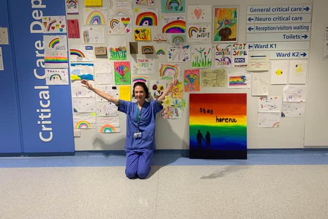 Dr Susie Thoms in front of the 'Rainbow Wall' at Sheffield's Royal Hallamshire Hospital.