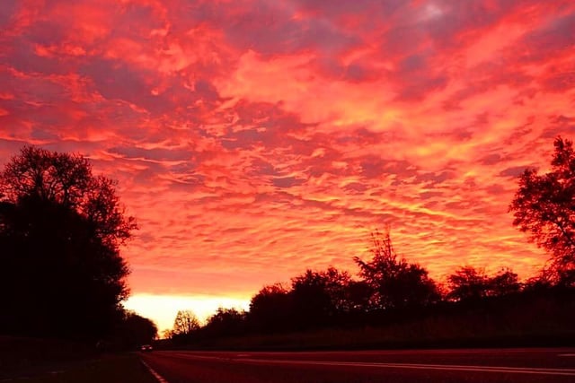 A dramatic blood-red sky gleamed off the road at Polkemmet this morning.