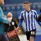 Liam Shaw leaves the field after his full Sheffield Wednesday debut against Middlesbrough.