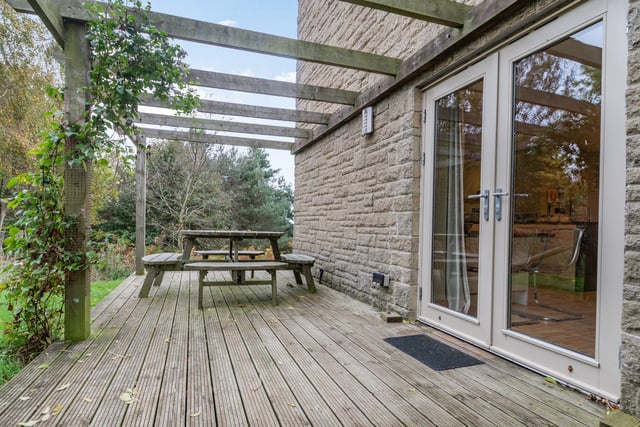 There is a part covered timber deck at the front of the house, while to the side there is an area of paved terracing, which is ideal for al-fresco dining. At the rear there is a further area of timber decking, with the decking and terracing surrounded by lawns.