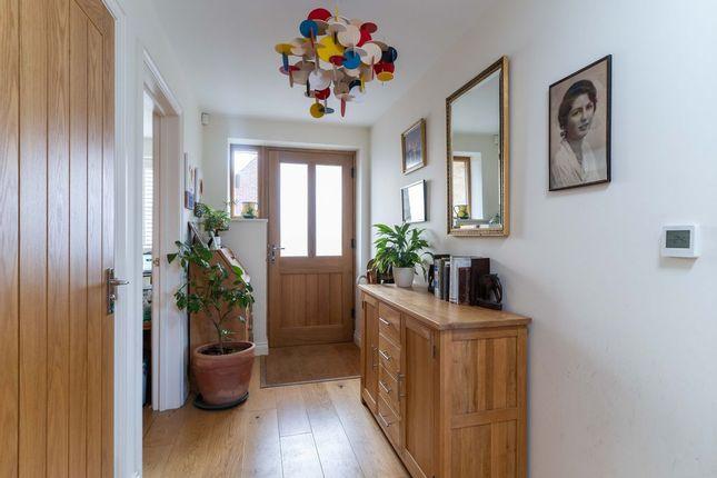 The spacious hallway provides access to the study, downstairs cloakroom, lounge and kitchen