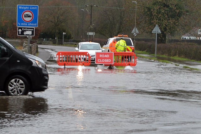 Road closed due to flooding at junction of Station Road and Church Street Darley Dale.