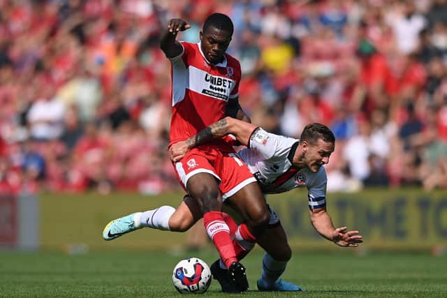 Middlesbrough player Anfernee Dijksteel challenges Billy Sharp of Sheffield United: Stu Forster/Getty Images