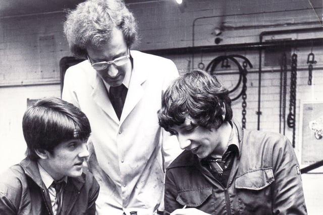 At work in the Motor Vehicle Department are 5th year pupils, from left Craig France and Philip Bell.  They are being instructed by Mr Richard Pickering, Motor Vehicle Studies Master in March 1980