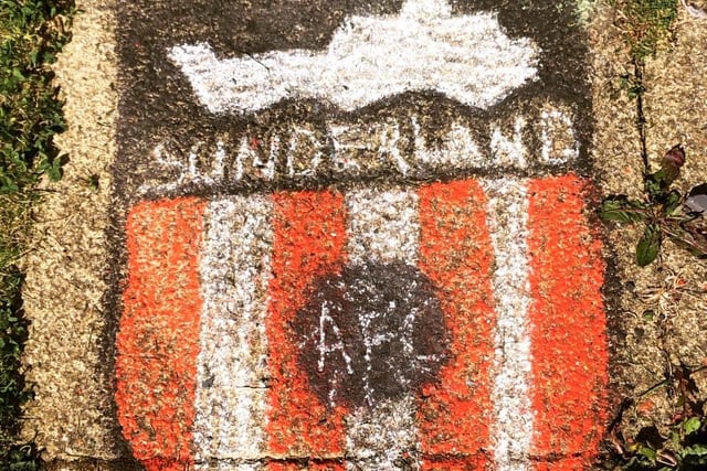 Nadia George drew a chalk drawing of the old Sunderland badge outside her house.