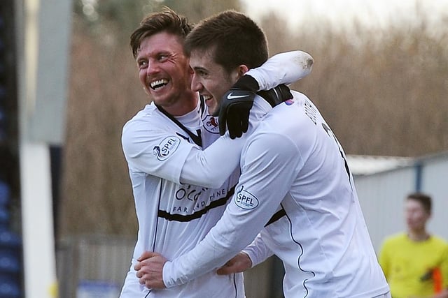 Joe Cardle celebrates with Calum Elliot after he scores from the spot