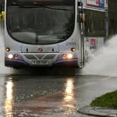A bus makes it's way through flood water File picture: Jonathan Gawthorpe