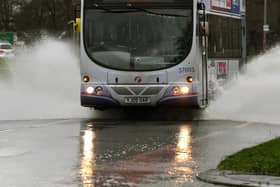 A bus makes it's way through flood water File picture: Jonathan Gawthorpe