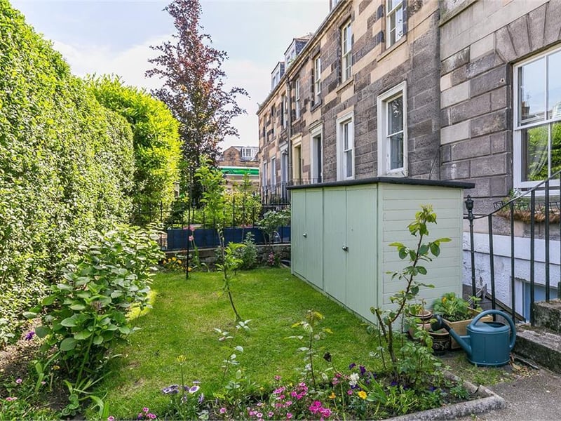 Shared front garden with storage.