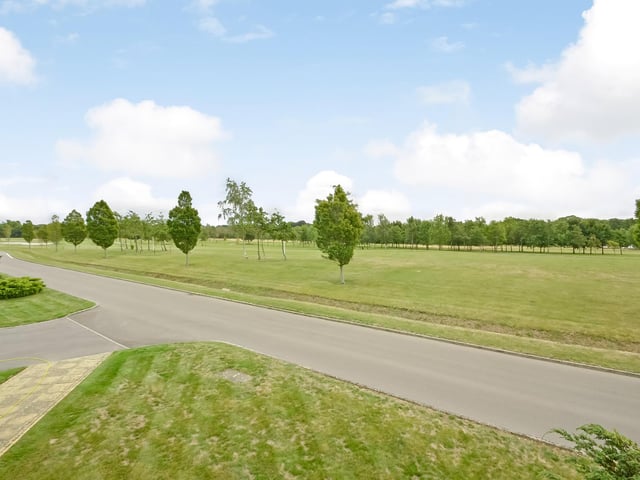 The strip of lawned garden between the manicured hedge and the driveway belongs to the house, Fine and Country says on its website.