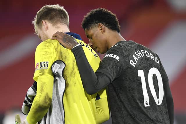 Manchester United's Marcus Rashford (right) and Sheffield United goalkeeper Aaron Ramsdale after the final whistle: Peter Powell/PA Wire.