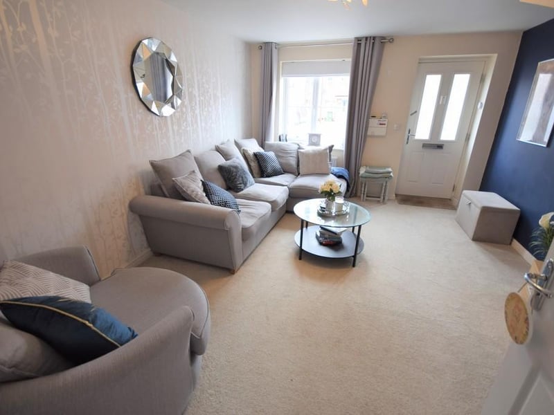 A stylishly decorated front facing room having various power points, tv aerial point, central heating radiator, UPVC double glazed window and an internal door opens to an inner hallway with stairs rising to the first floor landing.