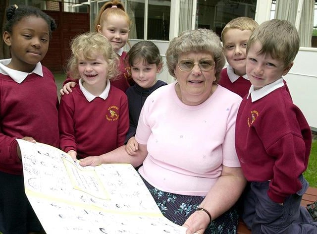 Freda Schofield, retiring after 27 years at the Bankwood Primary School, is pictured with some of the pupils, from left, Melanie Vernon, Kelly Marriott, Megan Hill, Demi-Lee Cartwright, Thomas Lindley and Jack Risson on May 12, 2000