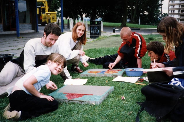 Young people at Norfolk Park working on murals as part of their efforts to improve the appearance of the shopping area in 1998
