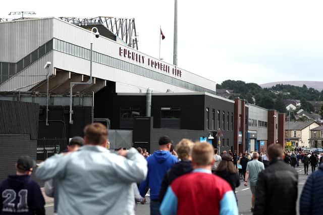 BURNLEY, ENGLAND - AUGUST 29: Fans arrive at the stadium prior to the Premier League match between Burnley  and  Leeds United at Turf Moor on August 29, 2021 in Burnley, England. (Photo by George Wood/Getty Images)