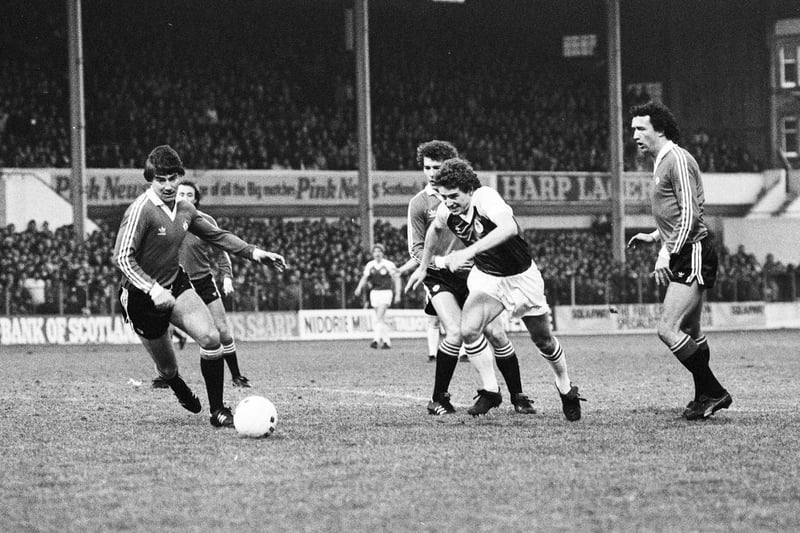 Not quite pre-season but on a wintry Boxing Day in 1981 with most games wiped out, Hibs - who had had undersoil heating installed in 1980 - invited Manchester United north for a friendly. The game ended in a 1-1 draw with Willie Jamieson on target. In the picture, Derek Rodier gets away from Bryan Robson as Martin Buchan (left) moves in