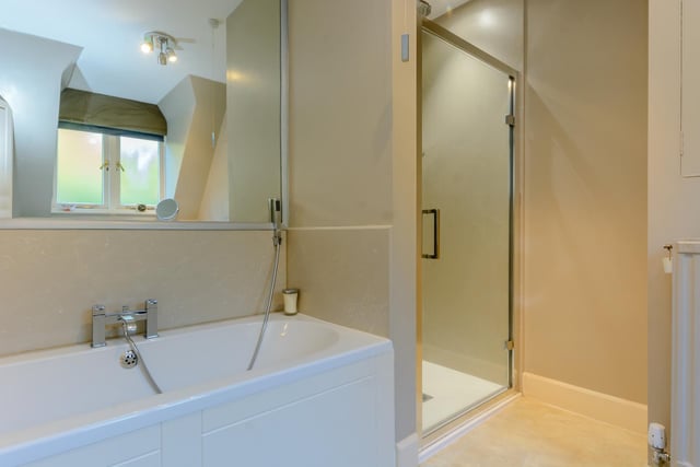 The master en-suite has a separate shower and bath.