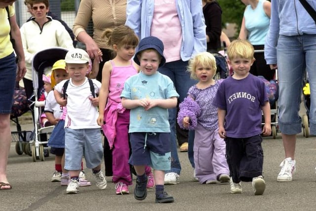 Children take part in a sponsored walk at Finningley in 2003.