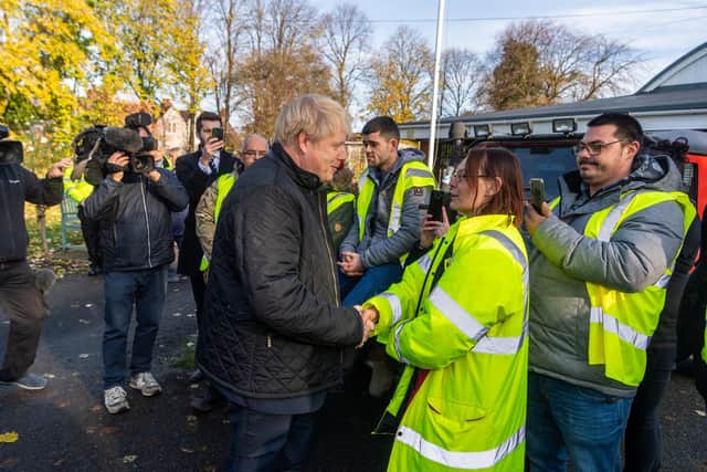 The Prime Minister Boris Johnson chatting to volunteer Rosemarie Squire at the Stainforth Community Resource Centre, Stainforth, Doncaster, following last November's floods